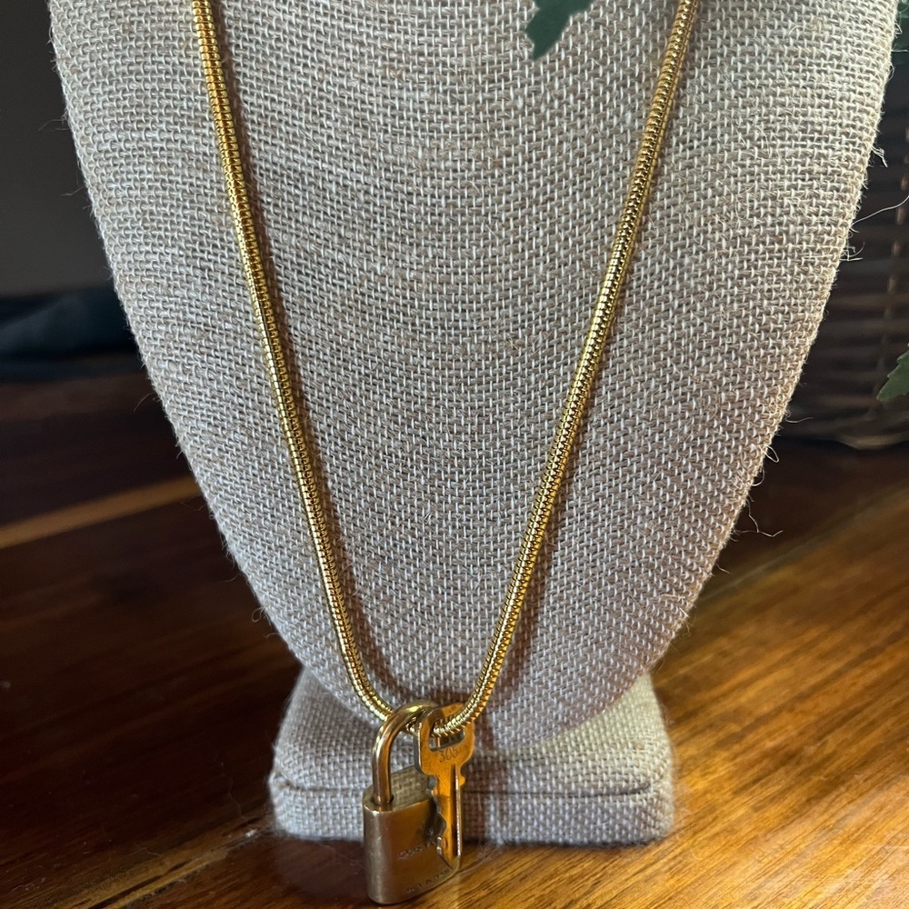 Louis Vuitton Gold Lock On off brand chain No 305 Works. Authentic